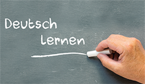 Kreideschrift auf einer Tafel: Deutsch Lernen Kreideschrift auf einer Tafel: Deutsch Lernen